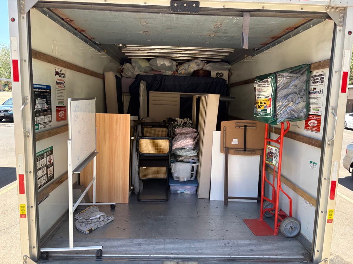Movers carrying furniture
